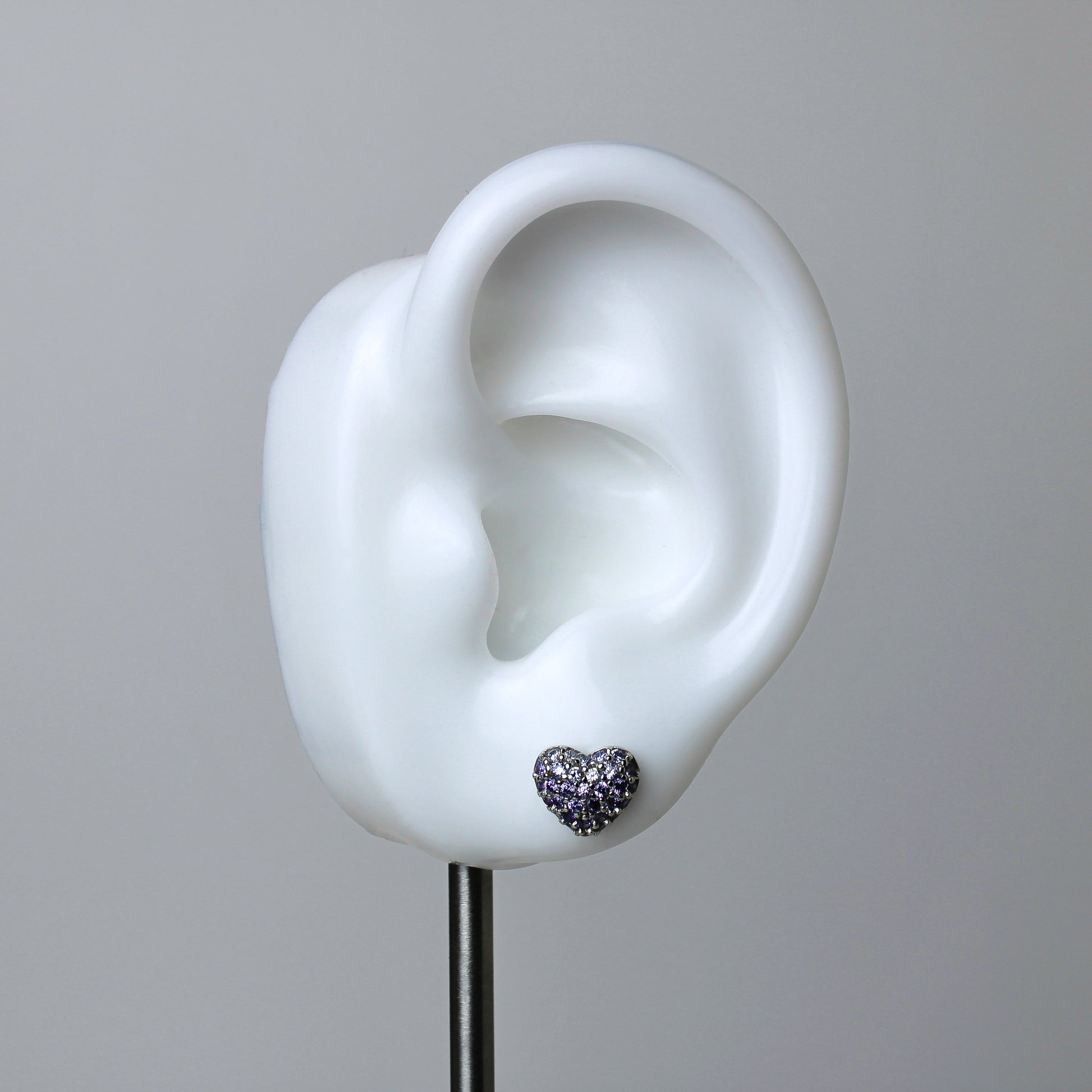 925 silver heart-shaped studs with white and indigo zirconia stones. 