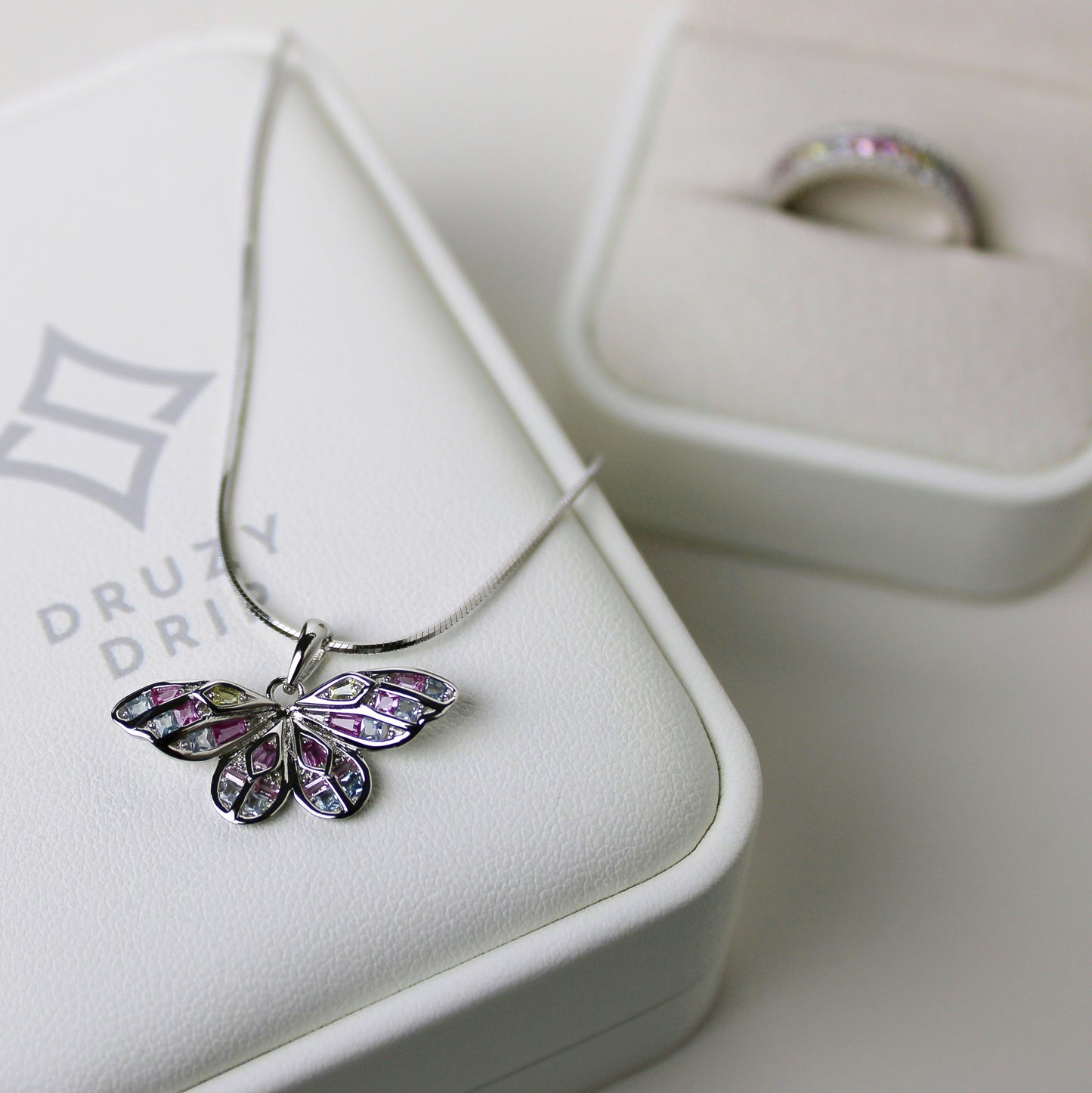 925 silver "butterfly necklace" with a rhodium-plating, hand-inlaid with pastel colored cubic zirconia. 